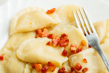 dumplings sprinkled with pork scratchings food background