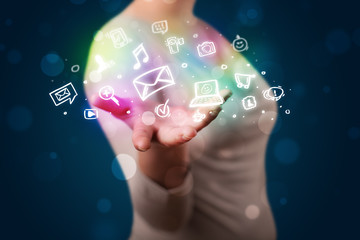 Young woman presenting colorful social media icons