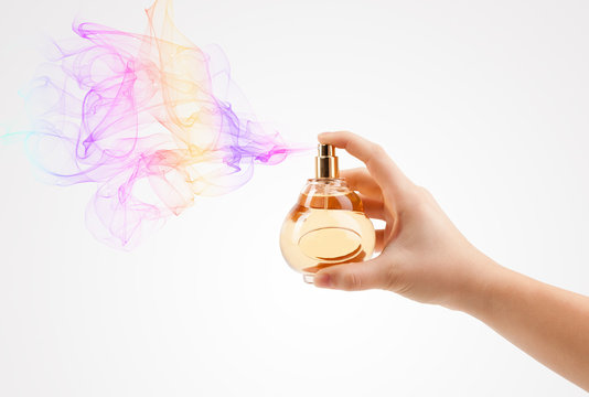 Woman Hands Spraying Perfume