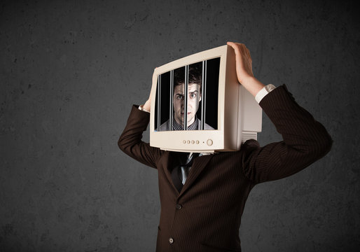 Business man with monitor on his head traped into a digital syst