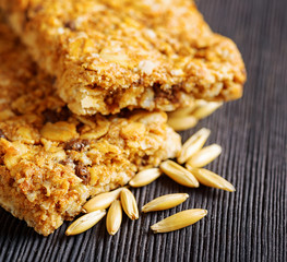 Oat granola bars on wooden table