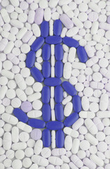 Pills and tablets white background with dolar symbol in blue