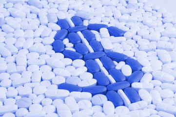 Pills and tablets white background with dolar symbol in blue