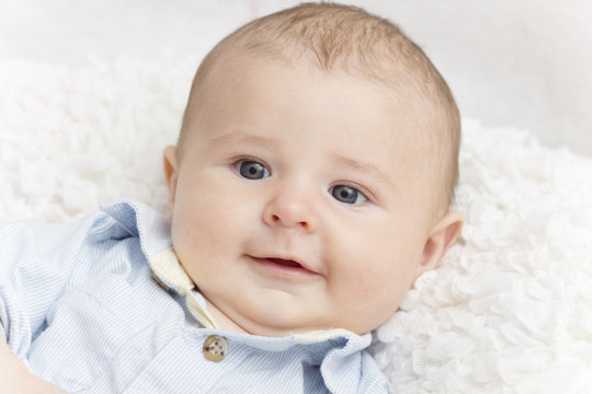 Smiling new baby boy portrait