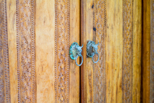 Wooden door with carving