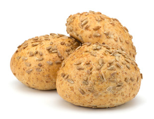 Round sandwich bun with sunflower seeds isolated on white backgr