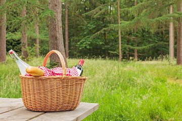Picnic basket in a woodland setting