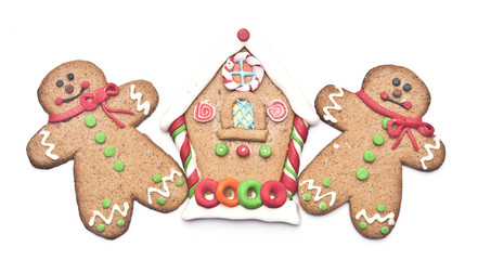 gingerbread house with gingerbread man on white background