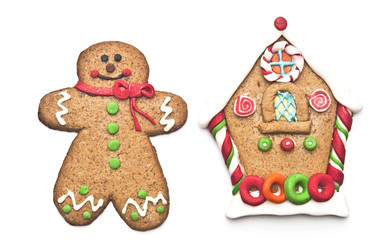 gingerbread house with gingerbread man on white background