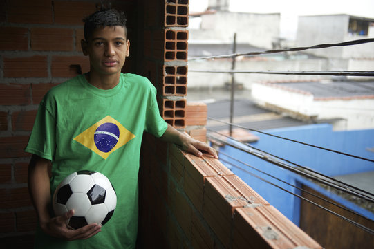 Portrait of Young Brazilian Soccer Player Standing with Football