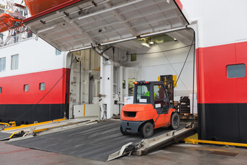 Big passenger ship loading with lift truck