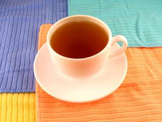 cup of coffee (tea) on white plate