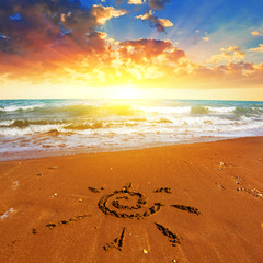 sun symbol on a sandy beach