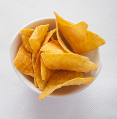 tortilla chips in white bowl