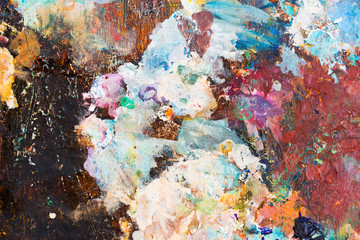 Colorful background made oil paints on a wooden