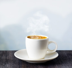 Cup of coffee on highlands background