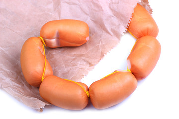 Sausages in paper packet isolated on white