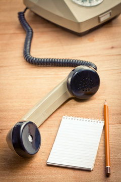 old telepnone handset with notebook