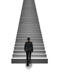 Rear view businessman climbing on stairs isolated in white