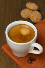 cup of espresso and biscotti cookies, selective focus