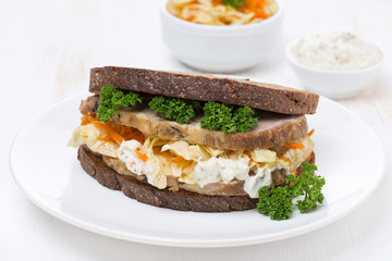 sandwich with coleslaw and baked meat, horizontal photo