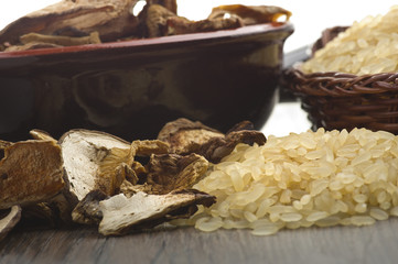Rice and dried porcini mushrooms on table