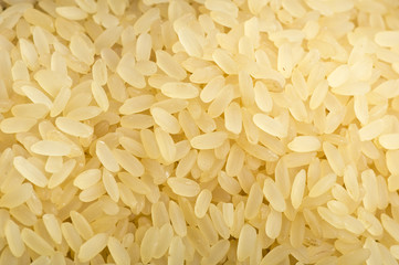 Uncooked rice close up on wooden table