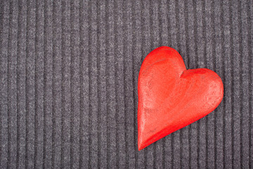 Red Wooden Heart on Knitted Background