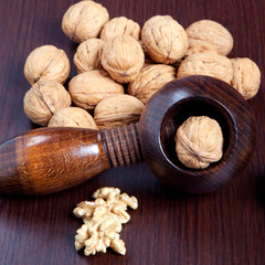 Walnuts and nutcracker close-up