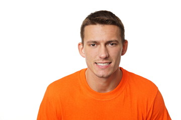 Portrait of young man at orange shirt