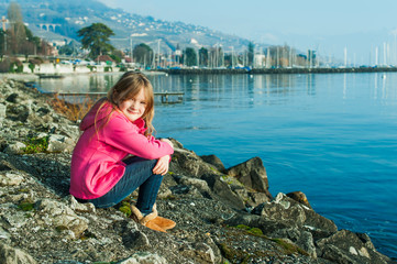 Outdoor portrait of a beautiful little girl on a nice sunny day