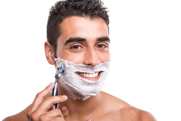 Man shaving his face