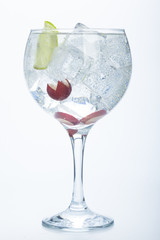 grape and lime gin tonic isolated over white