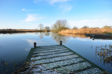 fishing platform jutting into river