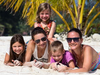 Happy family enjoy summer day at the beach