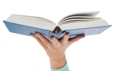 close up of woman hand holding open book