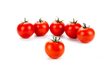 red tomatoes on a white background