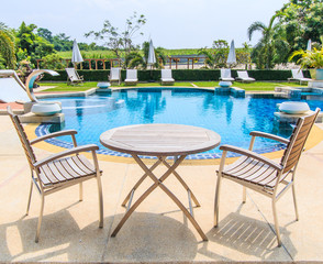 Table and chairs at the pool