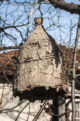 Old hanging beehive made of sticks and mud to capture wild bees