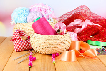Handicraft supplies on wooden table close-up