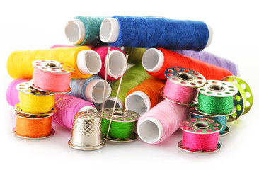 Composition with tailor needles and threads over white