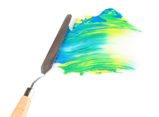 Painting palette knife with paint isolated on white