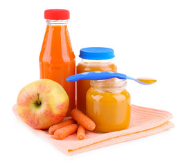 Baby food with carrot and apple in glass jars, isolated on