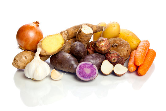 Raw vegetables - roots - on white background
