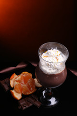 Tasty dessert with chocolate, cream and orange sauce,