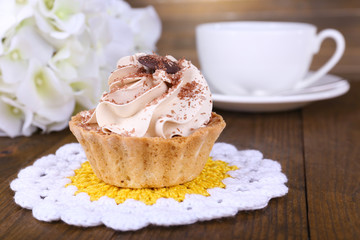 Tasty cake on table on wooden background