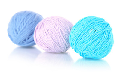 Balls of wool on wooden table background