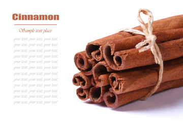 Bunch of cinnamon sticks closeup isolated on white