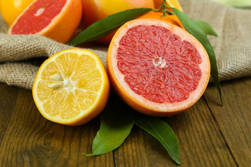 Lots ripe citrus on wooden background