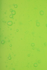 soap bubbles green liquid background